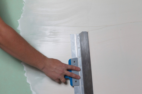 Application de mastic sur la surface Application de mastic sur la surface